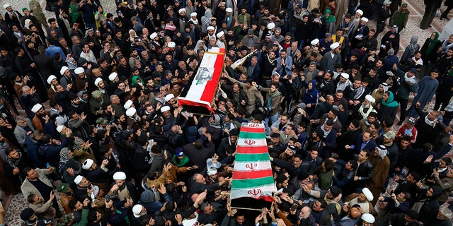Mourners carry the coffins of Soleimani and Abu Mahdi al-Muhandis, deputy commander of Iran-backed militias, at the Imam Ali shrine in Najaf, Iraq, on Saturday. (AP Photo/Anmar Khalil)