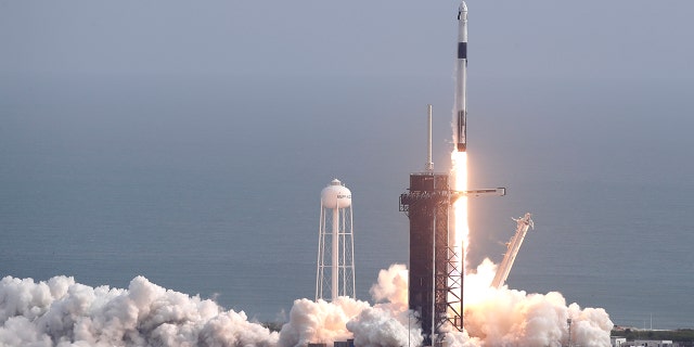 A Falcon 9 SpaceX rocket lifts off from pad 39A during a test flight to demonstrate the capsule's emergency escape system at the Kennedy Space Center in Cape Canaveral, Fla., Sunday, Jan. 19, 2020. (AP Photo/John Raoux)
