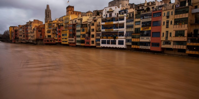 The river Onyar is seen swollen during a storm in Girona, Spain, on Thursday, Jan. 23, 2020.