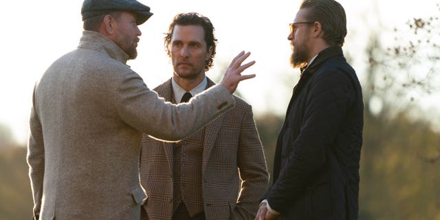 From l-r: Guy Ritchie, Matthew McConaughey, and Charlie Hunnam filming a scene from 'The Gentlemen.'