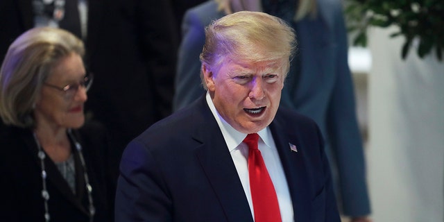 President Trump flashes a thumbs-up as he arrives at the World Economic Forum in Davos, Switzerland, Wednesday, Jan. 22, 2020. (Associated Press)