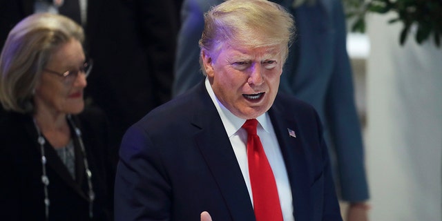 President Trump flashes a thumbs-up as he arrives at the World Economic Forum in Davos, Switzerland, Wednesday, Jan. 22, 2020. (Associated Press)