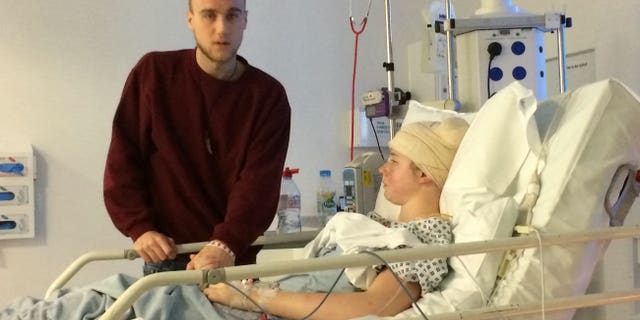 Laura Skerritt in the hospital with her boyfriend. 