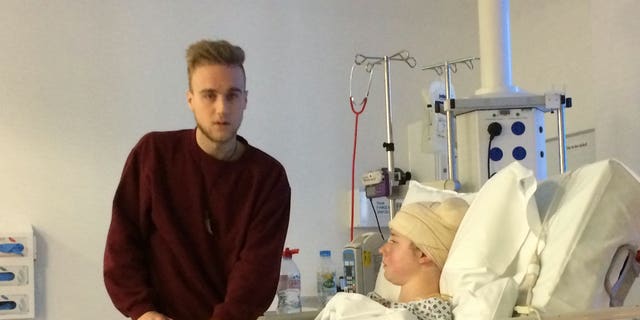 Laura Skerritt in the hospital with her boyfriend. 