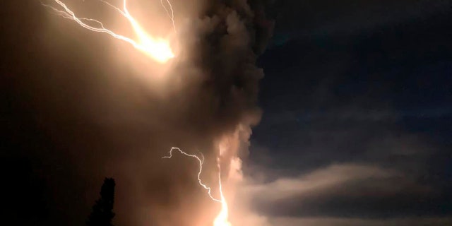 Lightning flashes as Taal Volcano erupts Sunday Jan. 12, 2020, in Tagaytay, Cavite province, outside Manila, Philippines.
