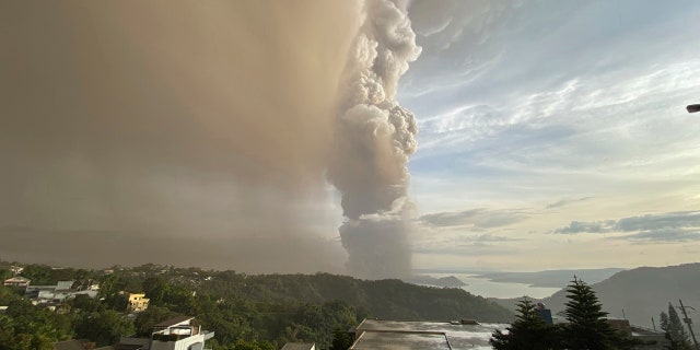 Plumes of smoke and ash rise from as Taal Volcano erupts Sunday Jan. 12, 2020, in Tagaytay, Cavite province, outside Manila, Philippines.