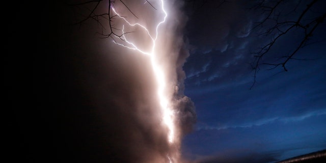 Lightning flashes as Taal Volcano erupts Sunday Jan. 12, 2020, in Tagaytay, Cavite province, outside Manila, Philippines.