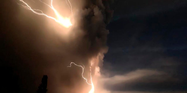 Lightning flashes as Taal Volcano erupts Sunday Jan. 12, 2020, in Tagaytay, Cavite province, outside Manila, Philippines.