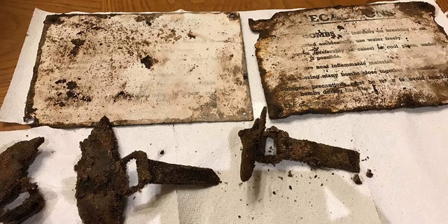 Bits of wood from the bomb crates, metal hinges and glass bottle caps from the bombs of incendiary bombs found on a beach at Loch Morlich. (Credit: SWNS)