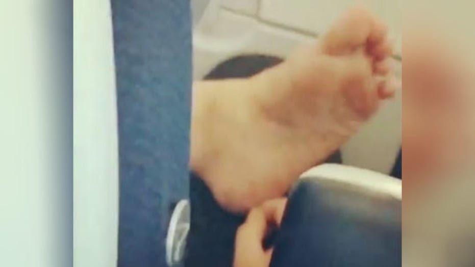 Social media shocked by video of airplane passenger picking dead skin