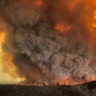 Wildfires rage under plumes of smoke in Bairnsdale, Australia, Dec. 30, 2019.