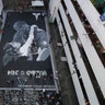 Artists put on the finishing touches on a giant mural of former NBA basketball player Kobe Bryant and daughter Gianna at a basketball court in Taguig, Philippines, Jan. 28, 2020. 