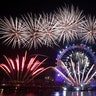 Fireworks marking the start of the new year explode over the London Eye Ferris wheel by the River Thames in London, Jan. 1, 2020. 