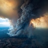Smoke rises from wildfires burning in East Gippsland, Victoria, Australia, Jan. 2, 2020. 