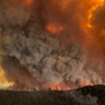 Wildfires rage under plumes of smoke in Bairnsdale, Australia, Dec. 30, 2019. 