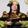 Billie Eilish holds her awards for best album, best pop vocal album, best song, best record and best new artist at the 62nd annual Grammy Awards in Los Angeles, Jan. 26, 2020. 