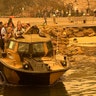 Evacuees are transported in a light amphibious resupply cargo transport amphibious vehicle from Mallacoota, Victoria, Australia, Jan. 2, 2020.