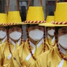 Imperial guards wear protective face masks during a reenactment of the Royal Guards Changing Ceremony in front of Deoksu Palace in Seoul, South Korea, Jan. 30, 2020.