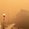 The HMAS Choules sails off the coast of Mallacoota, Victoria, Australia to provide support to people cut off by bush fires, Jan. 2, 2020