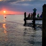 People line the pier in Key Largo, Florida, to watch the last sunset of the year, Dec. 31, 2019.