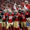 The San Francisco 49ers celebrate after an interception by defensive back Emmanuel Moseley during the first half of the NFC Championship football game against the Green Bay Packers in Santa Clara, Jan. 19, 2020.