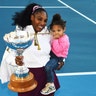 Serena Williams holds daughter Alexis Olympia Ohanian Jr. and the championship trophy after winning her singles finals match against Jessica Pegula at the ASB Tennis Classic in Auckland, New Zealand, Jan 12, 2020.