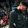 Houston Rockets guard Austin Rivers and forward P.J. Tucker react during a tribute to Bryant.