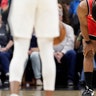 Toronto Raptors guard Kyle Lowry (7) holds his head down as players stop the action of a basketball game during the first half against the San Antonio Spurs. 