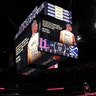 A tribute to Kobe Bryant illuminates the overhead scoreboard in Denver. 