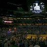 Fans stand for a moment of silence honoring Kobe Bryant before a game between the Orlando Magic and the LA Clippers.
