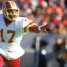 1987: Doug Williams #17 of the Washington Redskins scrambles with the ball during a 1987 NFL season game.