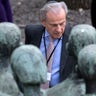 Nazi concentration camp survivor Jerry Wartski, who now lives in the U.S., stands behind the memorial during the commemoration ceremonies for the 73th anniversary of the liberation of former Nazi concentration camp Mittelbau-Dora near Nordhausen, Germany, on April 11, 2018.