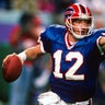 MINNEAPOLIS, MN - JANUARY 26: Jim Kelly #12 of the Buffalo Bills rolls out to pass against the Washington Redskins during Super Bowl XXVI at the Metrodome in Minneapolis, Minnesota January 26, 1992. The Redskins won the Super Bowl 37-24. 