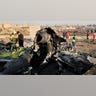 Debris is seen from an Ukrainian plane which crashed as authorities work at the scene of the crash of a Ukraine-bound plane in Shahedshahr, southwest of the capital Tehran, Wednesday, The jet carrying 176 people crashed on shortly after takeoff from Tehran's main airport, killing all on board. (AP Photo/Ebrahim Noroozi)