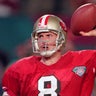 Jan. 29, 1995, Miami: Steve Young, #8 of the San Francisco 49ers, drops back to pass against the San Diego Chargers during Super Bowl XXIX at Joe Robbie Stadium. The Niners won the Super Bowl 49-26.