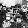 Jews wearing Star of David badges in the Lodz Ghetto, Poland, sometime during World War II. The Nazis forced Jews into overcrowded ghettos from where thousands were deported to the death camps.