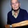 Holocaust and Auschwitz survivor Leon Schwarzbaum shows his tattooed identification number in his home in Berlin on Jan. 4, 2020.