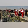 Rescue workers carry the body of a victim of a Ukrainian plane crash near Tehran, Iran. 
