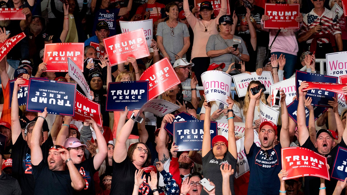 Supporters cheer as US President Donald Trump arrives to deliver remarks at a Keep America Great rally in Phoenix, Arizona, on February 19, 2020. (Photo by JIM WATSON/AFP via Getty Images)