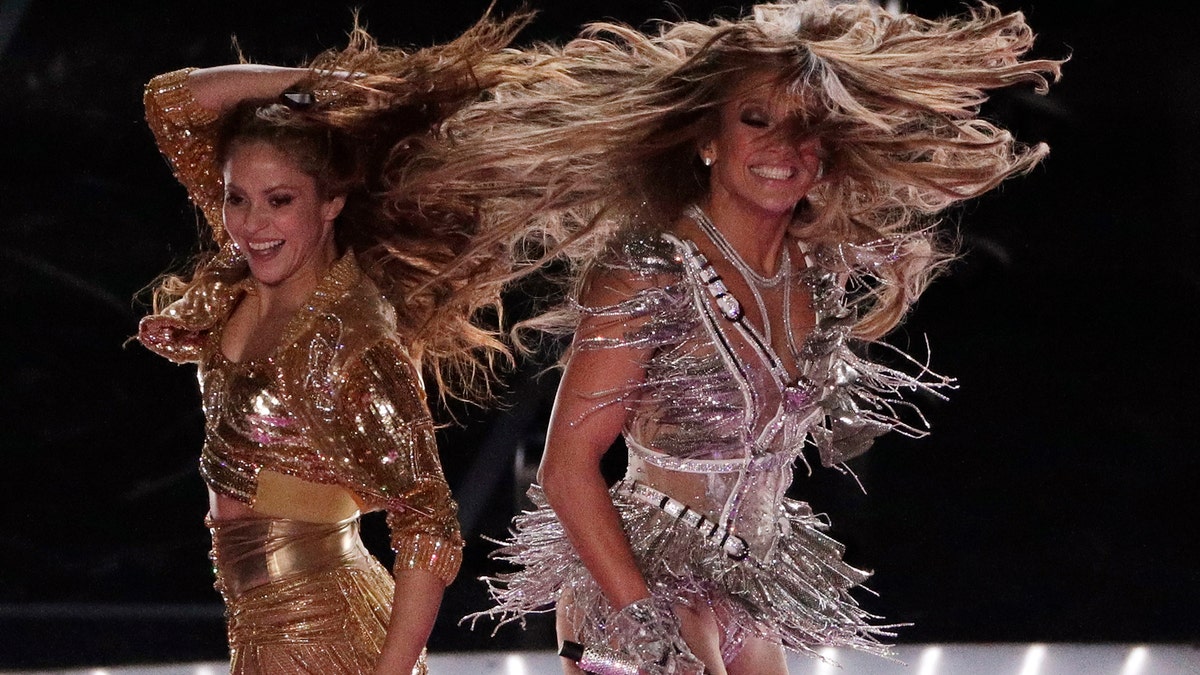 Singers Shakira, left, and Jennifer Lopez perform during the halftime show at the NFL Super Bowl 54.