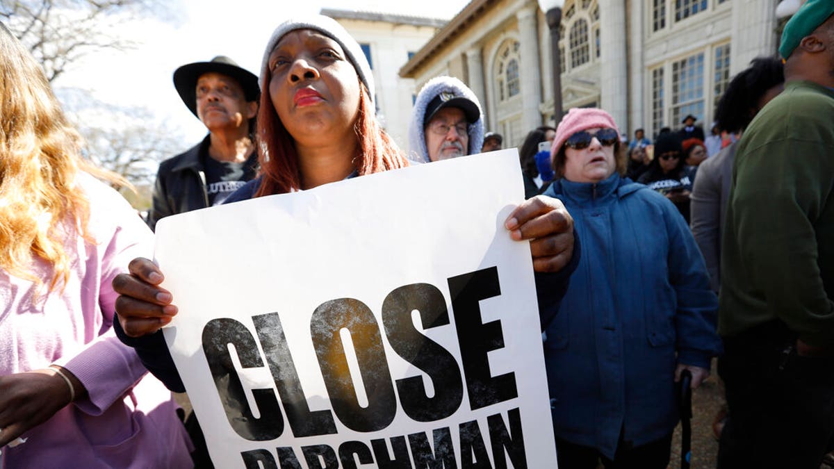 Many attendees of a rally at the Mississippi Capitol in Jackson, carried signs that protested conditions in prisons where inmates have been killed in violent clashes in recent weeks, Friday, Jan. 24, 2020.