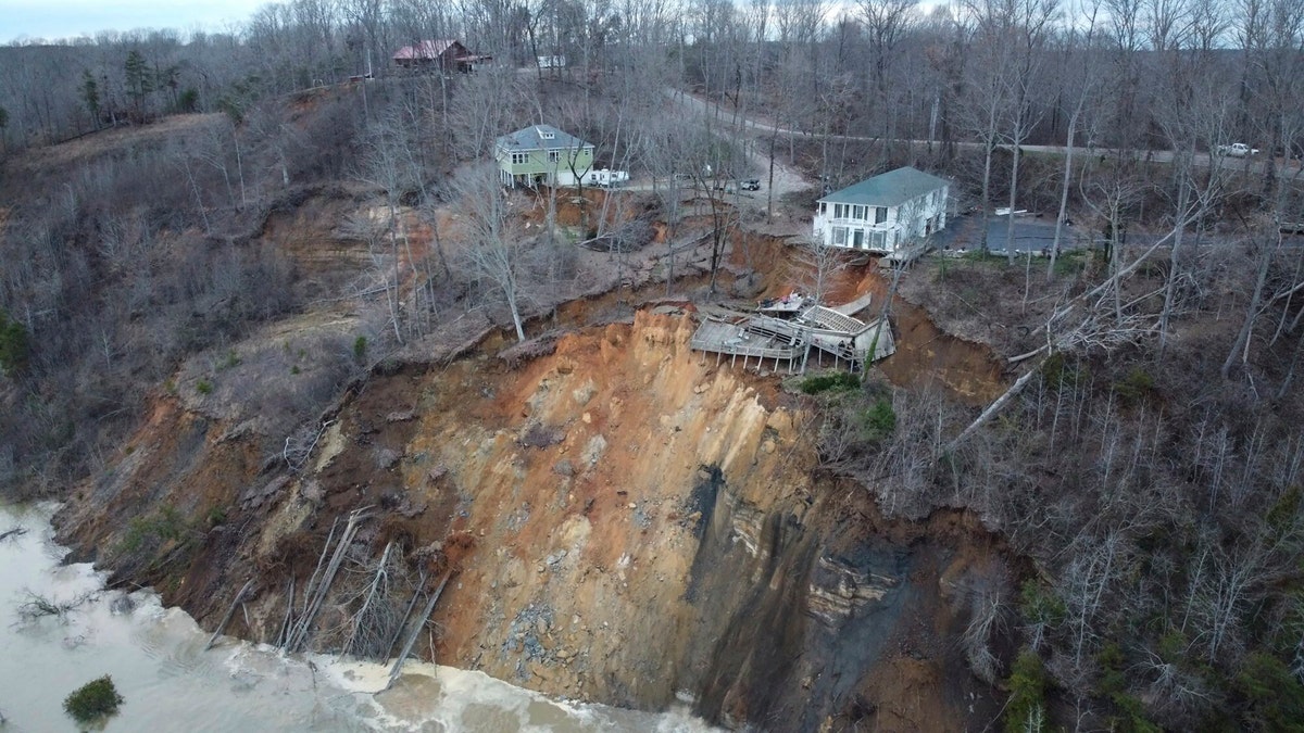 This drone photo provided by Hardin County Fire Department, Savannah, Tenn. on Feb. 15, 2003, shows the landslide on Chalk bluff on the Tennessee River. Authorities say two homes were destroyed when a hillside collapsed near a swollen river in western Tennessee.(Melvin Martin /Hardin County Fire Department, Savannah, Tenn. via AP)