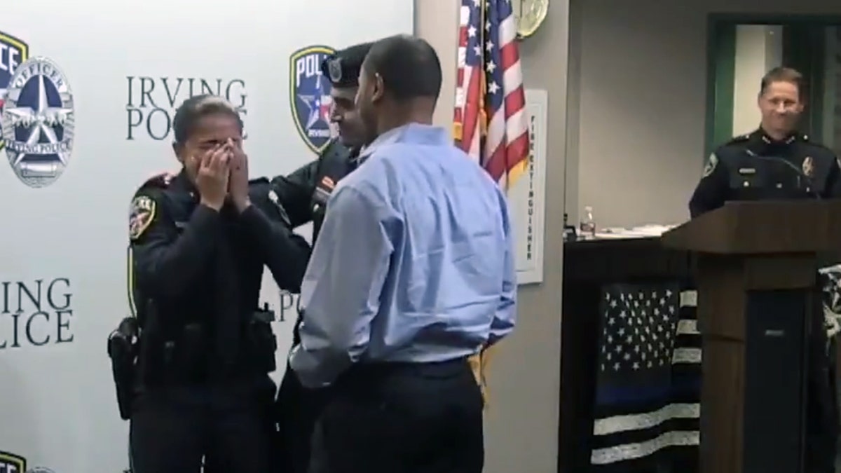 Irving Police Officer Erika Benning burst into tears after her son, Sgt. Giovanni Pando, surprised her during her swearing-in ceremony.