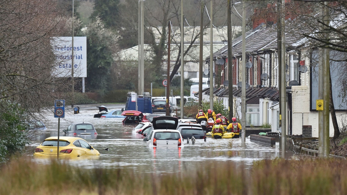 torm Dennis roared across Britain on Sunday, lashing towns and cities with high winds and dumping so much rain that authorities urged residents to protect themselves from flooding.