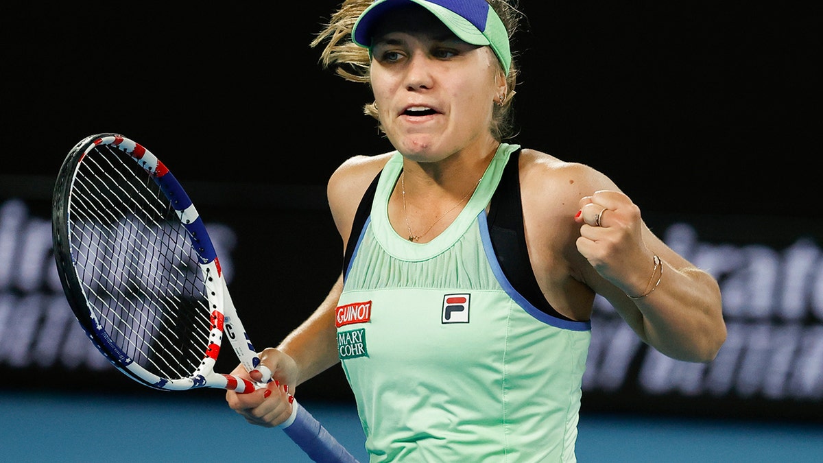 Sofia Kenin of the U.S. reacts after winning a point against Spain's Garbine Muguruza during the women's final at the Australian Open tennis championship in Melbourne, Australia, Saturday, Feb. 1, 2020. (AP Photo/Dita Alangkara)