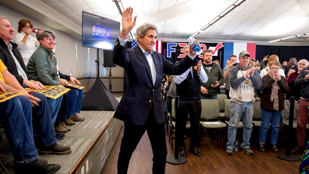 Former Secretary of State John Kerry arrives at a campaign stop for Democratic presidential candidate former Vice President Joe Biden at the South Slope Community Center, Saturday, Feb. 1, 2020, in North Liberty, Iowa. (AP Photo/Andrew Harnik)