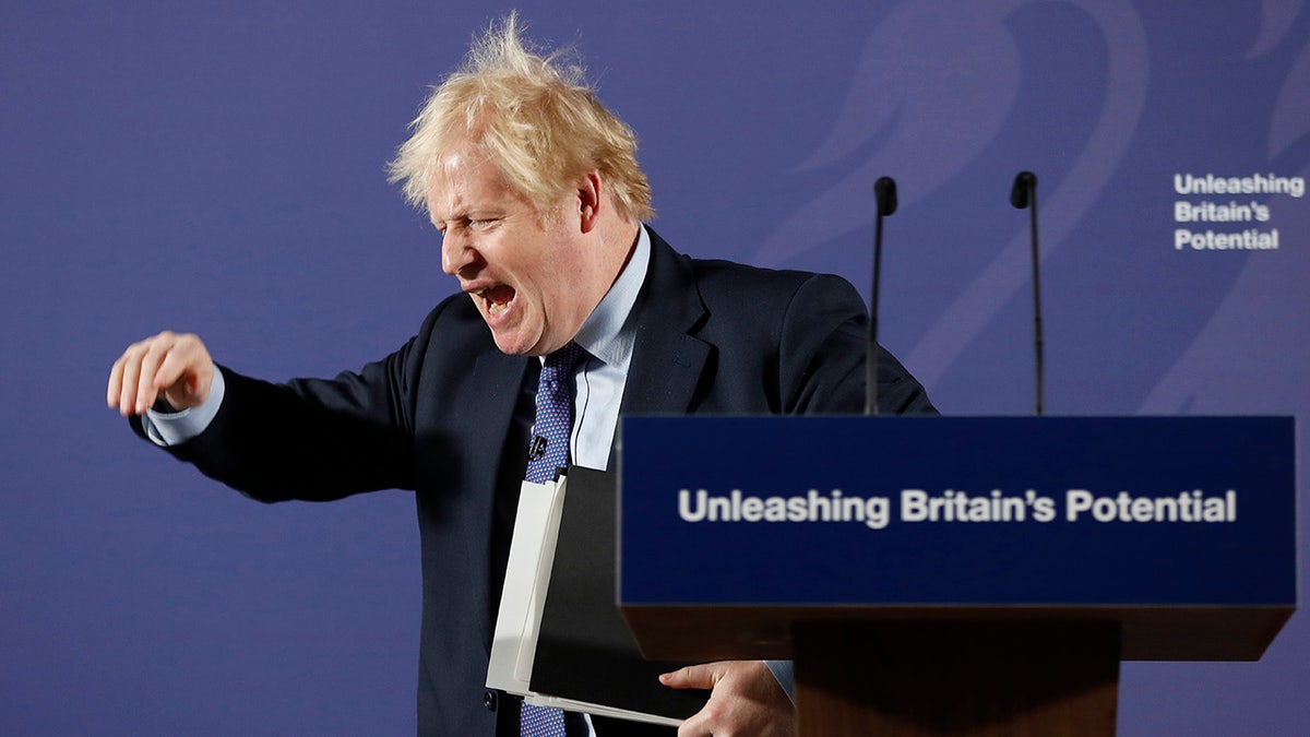 British Prime Minister Boris Johnson outlines his government's negotiating stance with the European Union after Brexit, during a key speech at the Old Naval College in Greenwich, London, Monday, Feb. 3, 2020. (AP Photo/Frank Augstein, Pool)