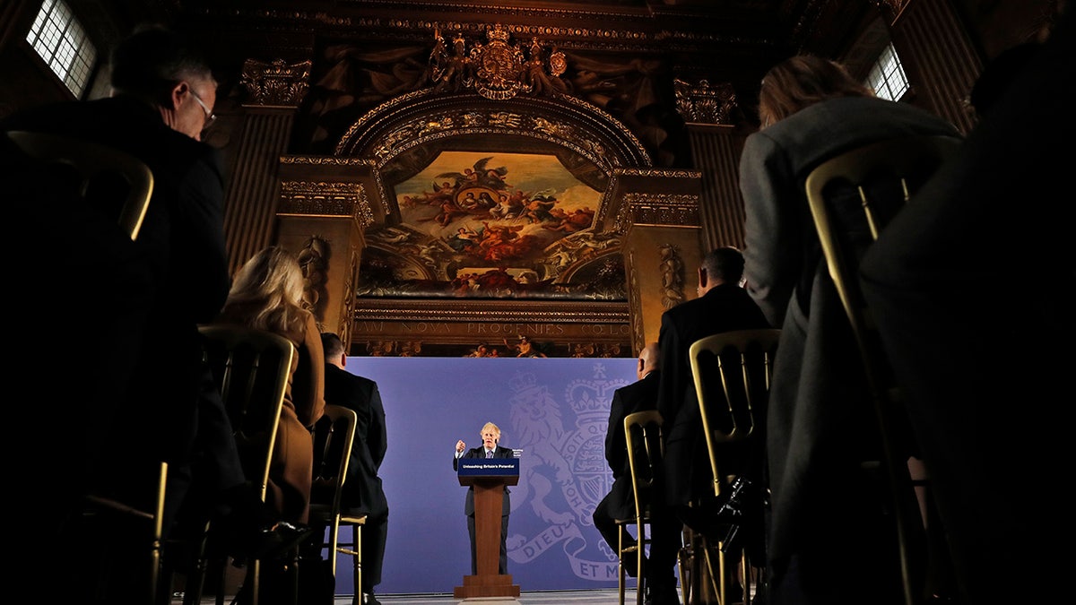 British Prime Minister Boris Johnson outlines his government's negotiating stance with the European Union after Brexit, during a key speech at the Old Naval College in Greenwich, London, Monday, Feb. 3, 2020. (AP Photo/Frank Augstein)