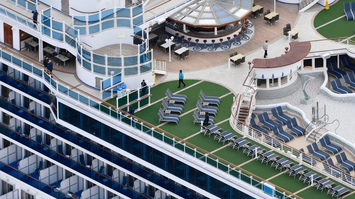 A passenger on the cruise ship has tested positive for a new virus after leaving the ship in Hong Kong on Jan. 25. The ship returned to Yokohama carrying 3,000 passengers and crew members after making port calls in Vietnam, Taiwan and Okinawa. (Kyodo News via AP)