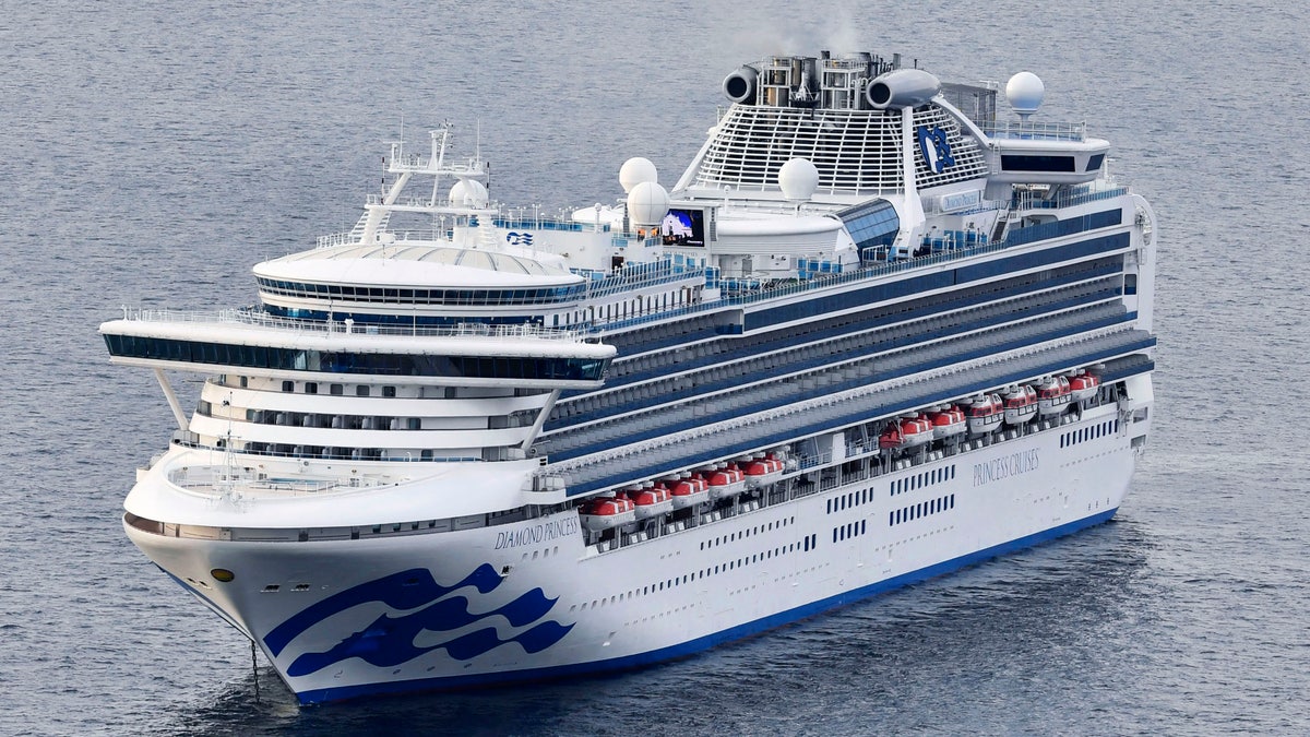 The cruise ship Diamond Princess anchors off the Yokohama Port upon arrival in Yokohama, near Tokyo Tuesday, Feb. 4, 2020. (Kyodo News via AP)